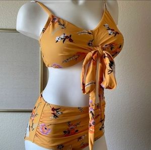 Very pretty 2 piece bathing suit. Yellow flowery, size Large. Only worn once.